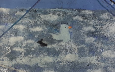 Textured painting of a seagull on a foamy sea