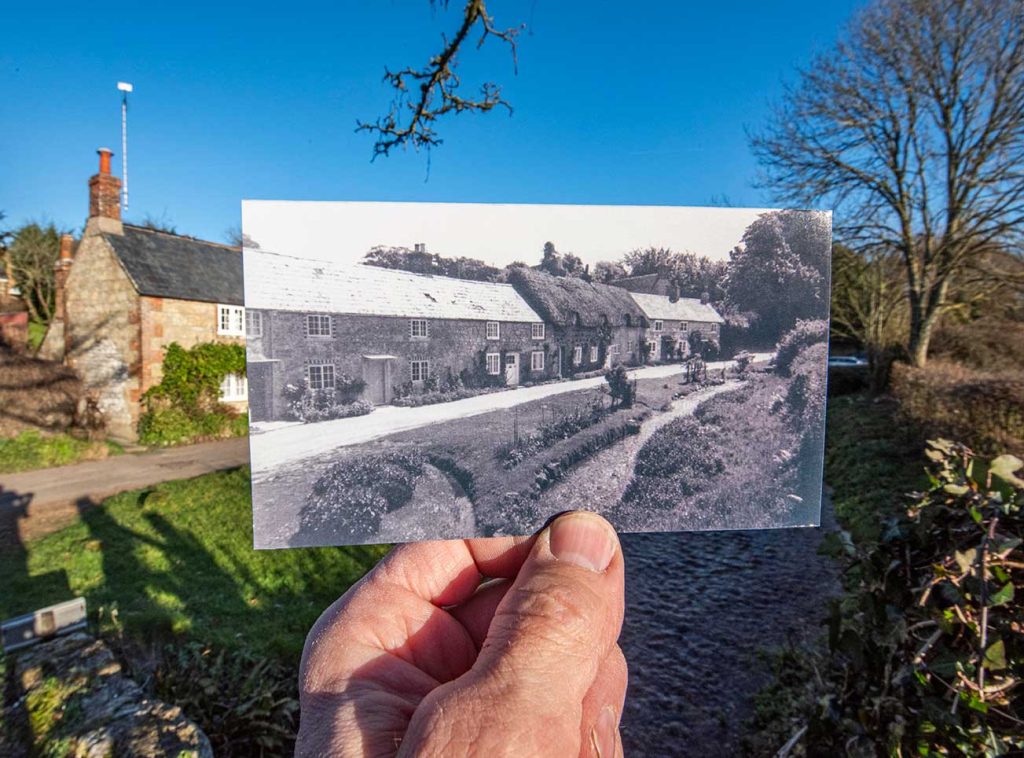 Artistic photo of a terrace of thatched cottages. Old photo held in front of cottages to show they are changed