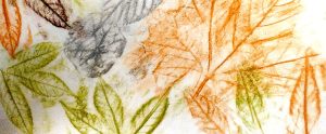 Green, orange and brown leaf rubbings